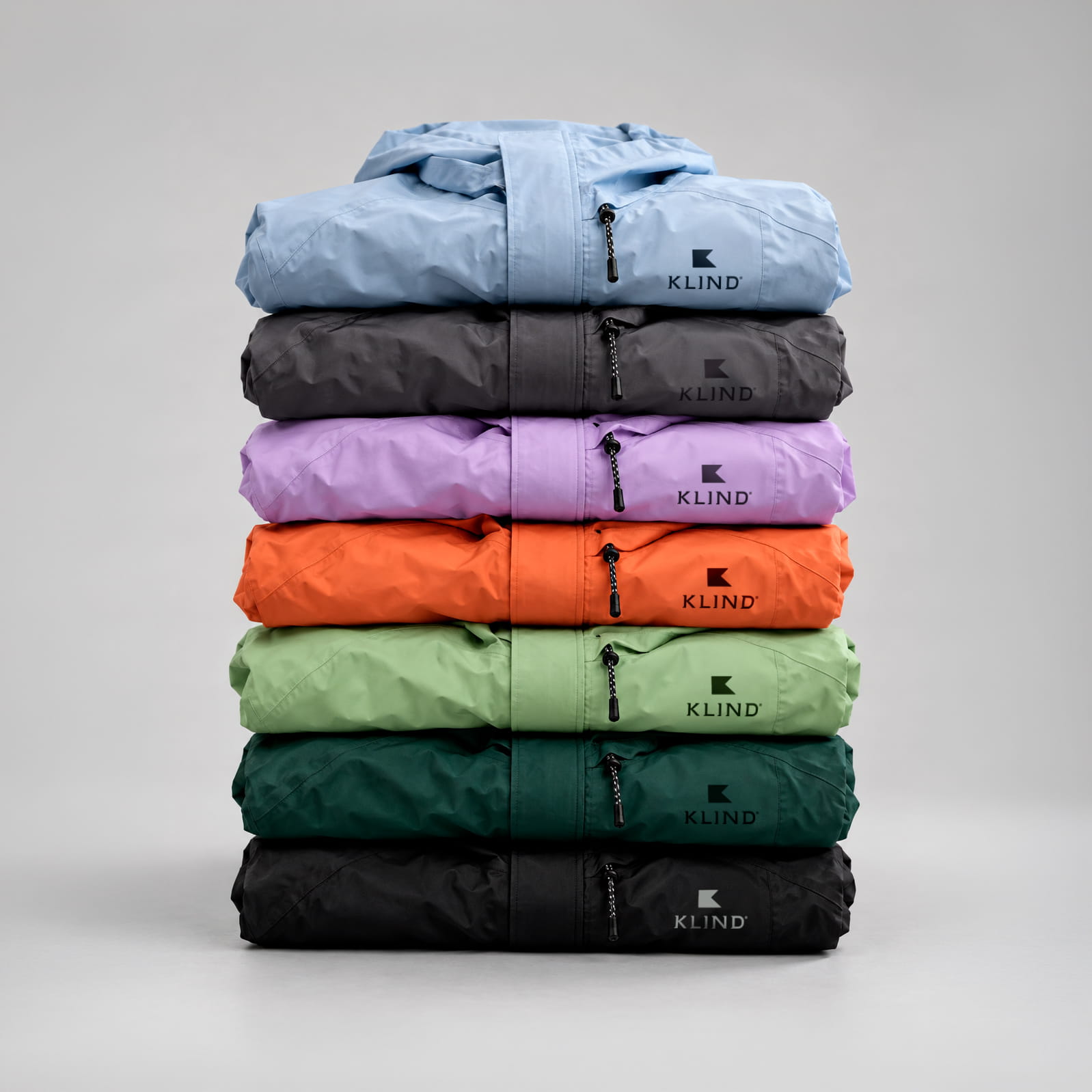 Pila de siete cortavientos de colores marca KLIND